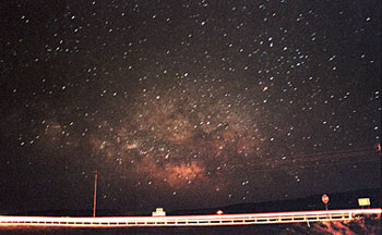 Milky Way over Highway 14, Los Cerrillos NM: photograph by Damon Taylor